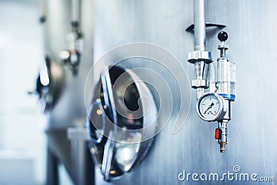 Brewery equipment producing craft beer. Stock Photo