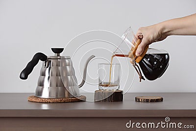 Brewing coffee in hand drip coffee maker. Woman hand pour coffee Stock Photo