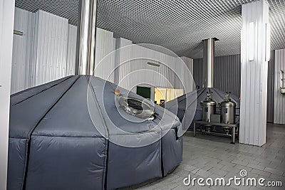 Brewing production, mash vats at modern beer factory, industrial fermenting tanks Stock Photo