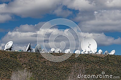 Satellite Antennas on hillside Editorial Stock Photo