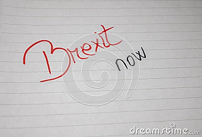 Brexit now, handwriting text on paper, political message. Political text on office agenda. Concept of democracy, voting, politics Stock Photo
