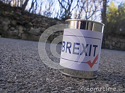 Brexit tin can in the road ready for a kick, UK EU politics metaphor or concept. Stock Photo