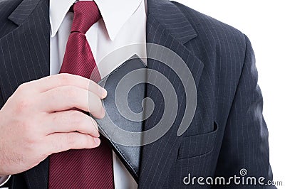 Bribe or bribery concept with wallet from inside suit jacket Stock Photo
