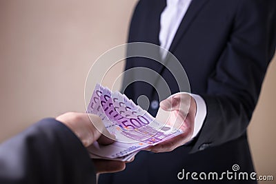 Bribe and corruption with euro banknotes. Stock Photo