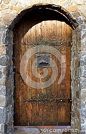 Brick arch with wooden doors Stock Photo