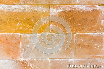 Brick background abstract weathered texture of stained old light brown stucco and painted red yellow wall in rural room Stock Photo