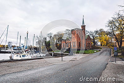 Brick Church and Yachts at Kastellholmen Island in Stockholm Stock Photo