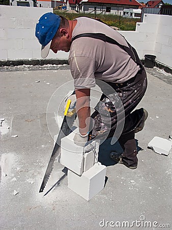 Brick cutting Stock Photo