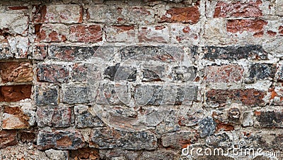 Brick House wall with flaking plaster Stock Photo