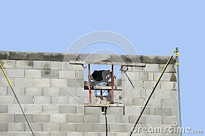 A brick layer at work Stock Photo