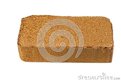 Brick of pressed coconut coir Isolated on white Stock Photo