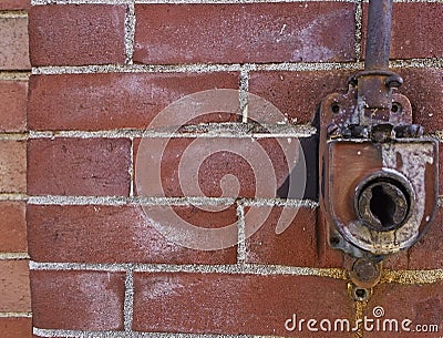 Brick wall with awning opening crank Stock Photo