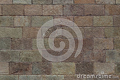 Brick wall background. Old brickwork with multicolor bricks in tints of pink, yellow, green Stock Photo