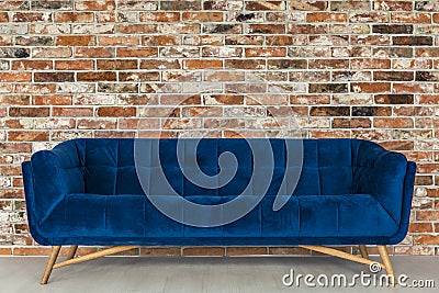 Brick wall and blue sofa Stock Photo