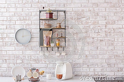 Shelf with kitchenware on brick wall Stock Photo