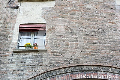 Brick wall of the old italian house with one window Stock Photo