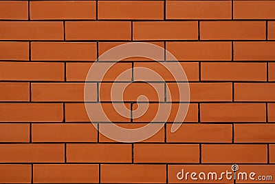 Brick wall in orange Take detailed pictures. The deep grooves in the brickwork are visible Stock Photo