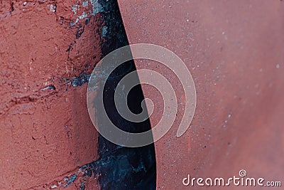 Brick wall and rusty bent sheet of metal Stock Photo