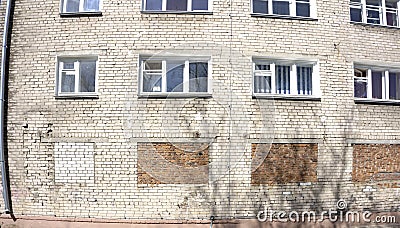 Bricked in window on an old brick building - orange bricks Stock Photo