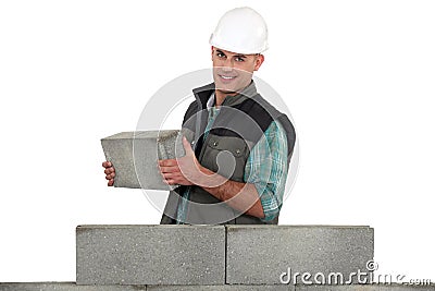 Bricklayer building a wall Stock Photo