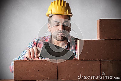 Bricklayer building a wall Stock Photo