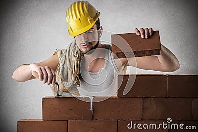 Bricklayer building a wall Stock Photo