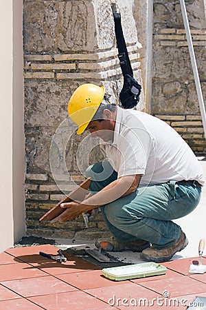 Bricklayer at work Stock Photo