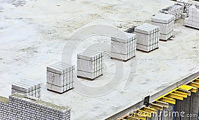 Bricklayer work on a building site - place of work of bricklaying worker on a construction site of a big residential house. White Stock Photo