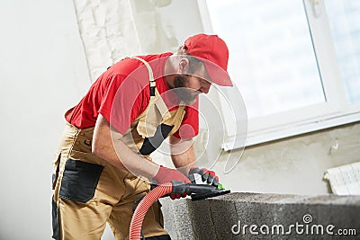 Bricklayer working with ceramsite concrete blocks. Walling Stock Photo