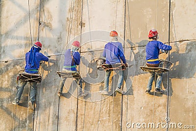 Bricklayer working on the high building Stock Photo