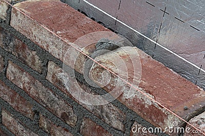 Bricks, mortar and a masonry line Stock Photo