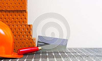 Bricks trowel and a helmet. Stock Photo