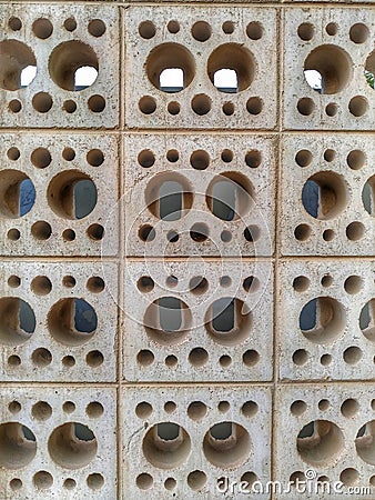 Bricks wall with round holes abstract Stock Photo