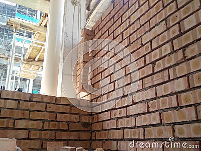 Brickwall is being erected by construction workers at construction sites. Editorial Stock Photo