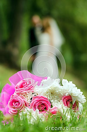 Bridal bouquet on a background of blurred silhouette of a bride Stock Photo