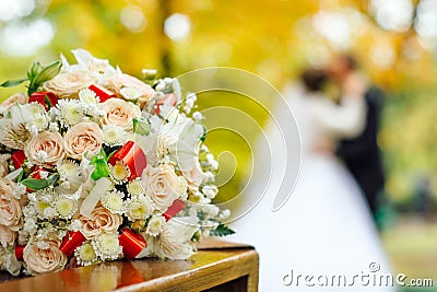 Bridal bouquet on a background of blurred silhouette of a bride Stock Photo