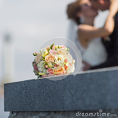 Bridal bouquet on granite embankment Stock Photo