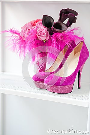 Bridal bouquet of roses and pink shoes Stock Photo