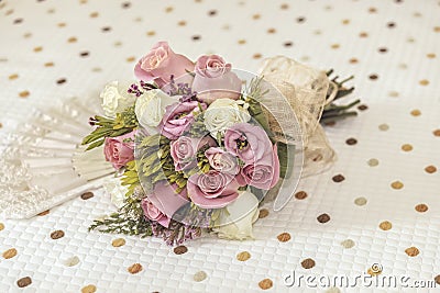 Bridal bouquet of roses with a Spanish hand fan Stock Photo