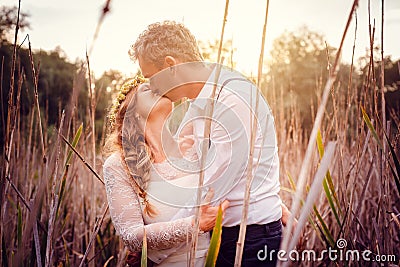 Bridal couple kissing during the after wedding photoshoot Stock Photo