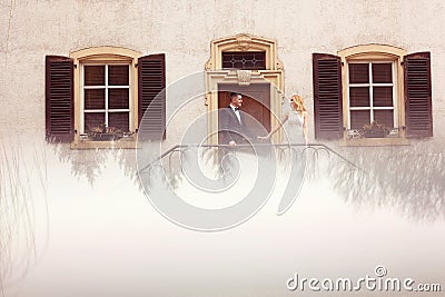 Bridal couple on stairs of their house Stock Photo