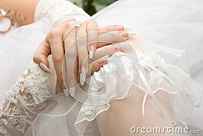 Bridal manicure and garter Stock Photo