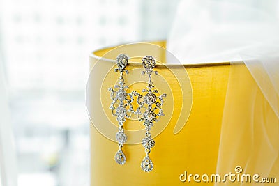 Bridal veil and long Silver earrings with diamonds Stock Photo