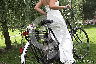 Bride on a bike Stock Photo