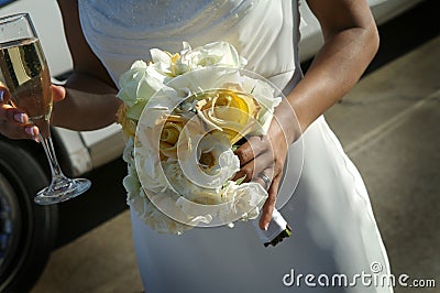 Bride with bouquet and champagne Stock Photo