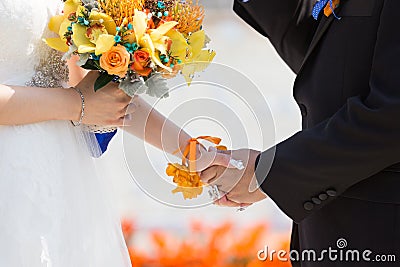 Bride and bridegroom hand in hand Stock Photo