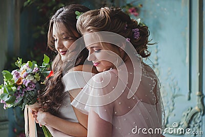 Bride and bridesmaids. Beautiful young women in dresses Stock Photo