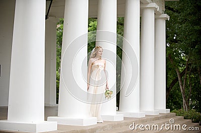 Bride on a columned porch Stock Photo