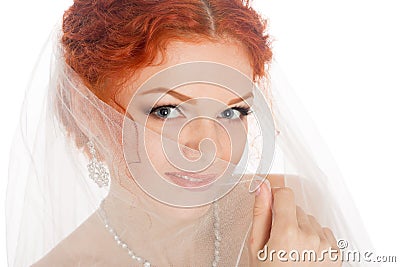 Bride covered her face with a veil Stock Photo