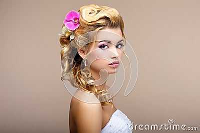 Charm. Portrait of Elegant Blond hair Woman Fiancee with Flowers. Womanliness Stock Photo